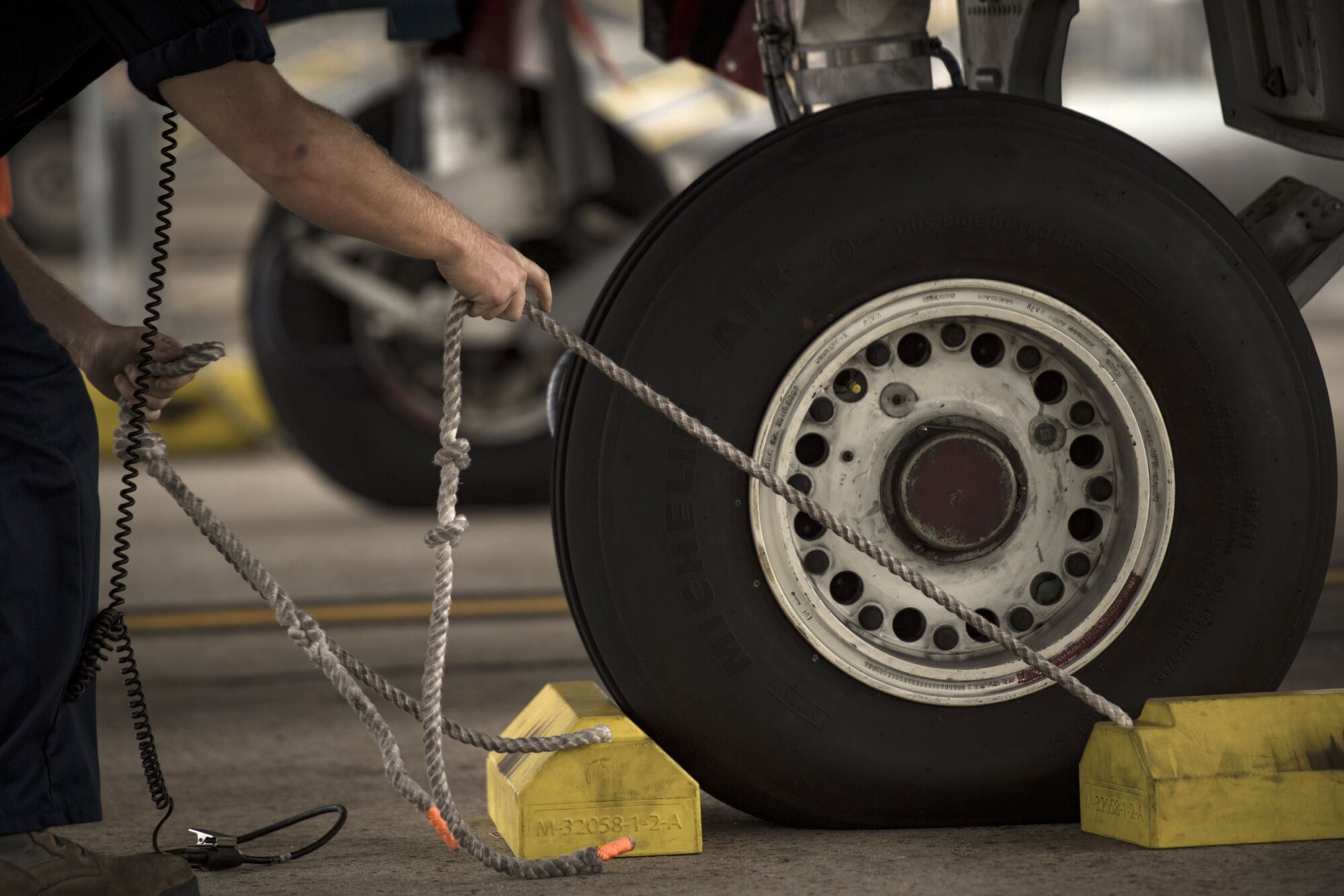 Airman 1st Class Tyler Boyd, 74th Aircraft Maintenance Unit crew chief, pulls chalks from under the tires of an A-10C Thunderbolt II, Dec. 6, 2017, at Moody Air Force Base, Ga. Moody’s week-long, Phase 1, Phase 2 exercise is designed to demonstrate the 23d Wing’s ability to meet combatant commander objectives and tested the pilots’ and maintainers’ ability to launch around-the-clock sorties at an accelerated rate during a sortie surge. (U.S. Air Force photo by Staff Sgt. Ryan Callaghan)