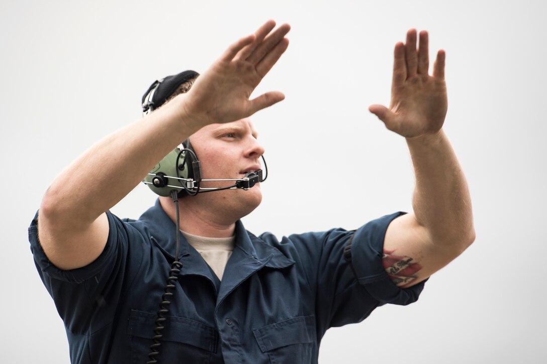 Airman 1st Class Tyler Boyd, 74th Aircraft Maintenance Unit crew chief, marshals an A-10C Thunderbolt II onto the taxiway, Dec. 6, 2017, at Moody Air Force Base, Ga. Moody’s week-long, Phase 1, Phase 2 exercise is designed to demonstrate the 23d Wing’s ability to meet combatant commander objectives and tested the pilots’ and maintainers’ ability to launch around-the-clock sorties at an accelerated rate during a sortie surge. (U.S. Air Force photo by Staff Sgt. Ryan Callaghan)