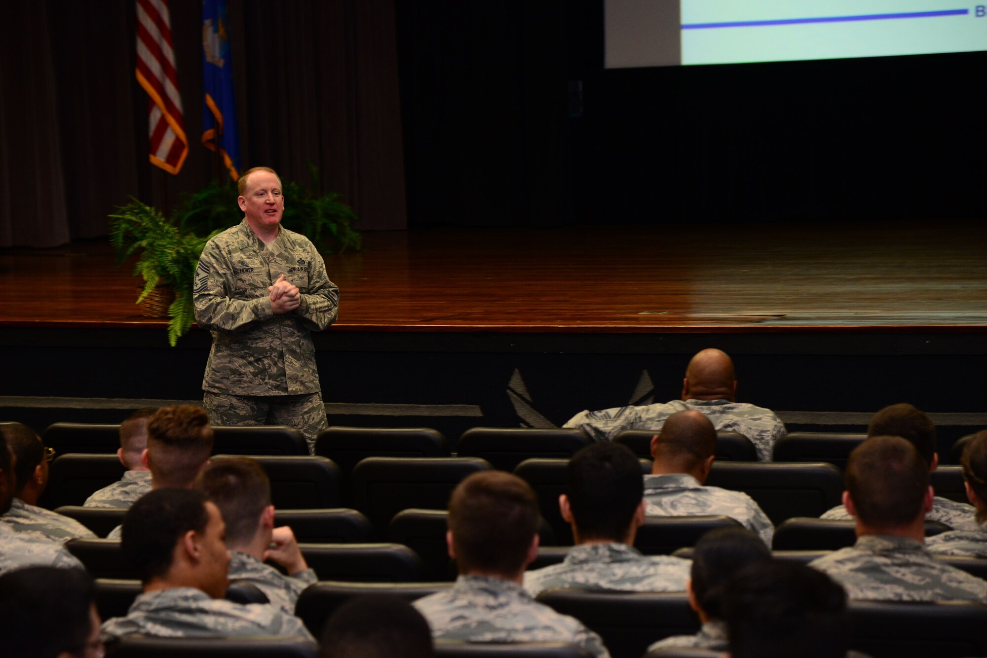 Chief Master Sgt. Johnathan Hover, 14th Flying Training Wing Command Chief, speaks with enlisted Airmen at an enlisted all call Dec. 1, 2017, at the Kaye Auditorium on Columbus Air Force Base, Mississippi. During his all call Hover discussed future events, expectations of Airmen and welcomed feedback about items of interest such as the Wing Commander Shadow Program, promotion ceremonies, wing mentorship programs and more. (U.S. Air Force photo by Airman 1st Class Beaux Hebert)