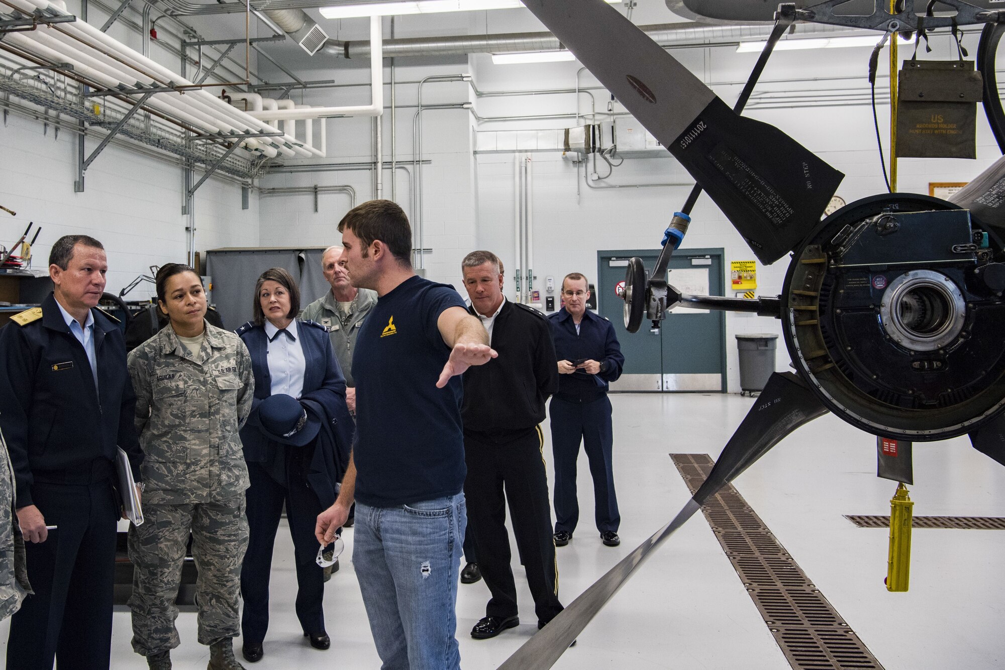 Tim Sayre, a contractor for the 130th Airlift Wing’s Engine Regional Repair Center, explains the engine rebuild program to Peruvian Air Force Maj. Gen. Gregorio C. Mendiola, Assistant Defense and Air Attaché for the Embassy of Peru, Nov. 21, 2017 at McLaughlin Air National Guard Base, Charleston, W.Va. Mendiola visited the 130th Airlift Wing to see first hand the domestic response capabilities of Air National Guard assets at the wing including the C-130H and aeromedical evacuation mission. The work of the 130th AW Engine Regional Repair Center helps to save more than $500,000 per engine by rebuilding and repairing or overhauling C-130H engines and propellors locally. (U.S. Air National Guard Photo by Airman Caleb Vance)