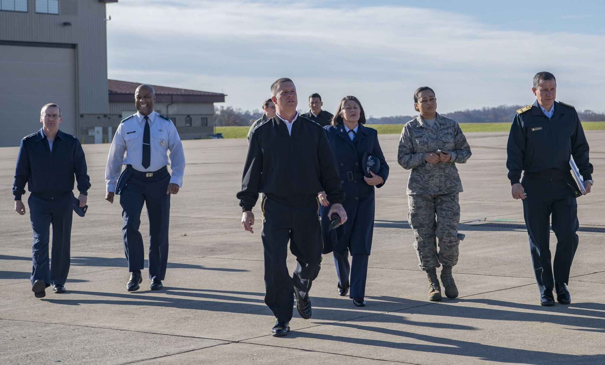 West Virginia National Guard leadership along with Peruvian Air Force Maj. Gen. Gregorio C. Mendiola, Assistant Defense and Air Attaché for the Embassy of Peru, walk out to a C-130H Nov. 21, 2017 at McLaughlin Air National Guard Base, Charleston, W.Va. Mendiola visited the 130th Airlift Wing to see first hand the domestic response capabilities of Air National Guard assets at the wing including the C-130H and aeromedical evacuation mission. (U.S. Air National Guard Photo by Airman Caleb Vance)