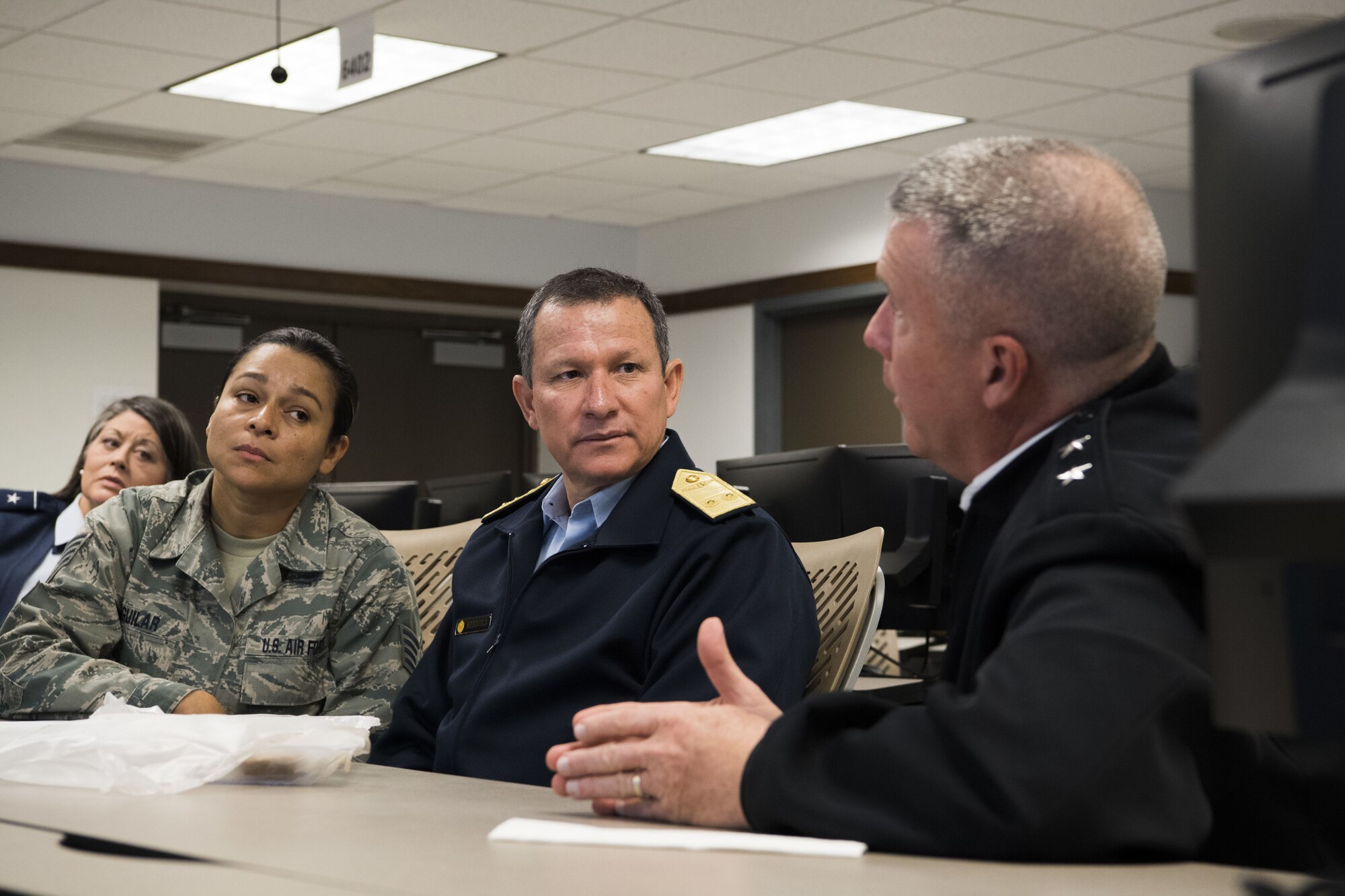 U.S. Army Maj. Gen. James A. Hoyer, the Adjutant General of West Virginia National Guard, discusses domestic response operations and capabilities with Peruvian Air Force Maj. Gen. Gregorio C. Mendiola, Assistant Defense and Air Attaché for the Embassy of Peru, at the WVNG Joint Force Headquarters Joint Operations Center (JOC). Mendiola visited the 130th Airlift Wing and JFHQ to see first hand the domestic response capabilities of Army and Air National Guard assets including the C-130H and aeromedical evacuation mission. (U.S. Air National Guard Photo by Capt. Holli Nelson)