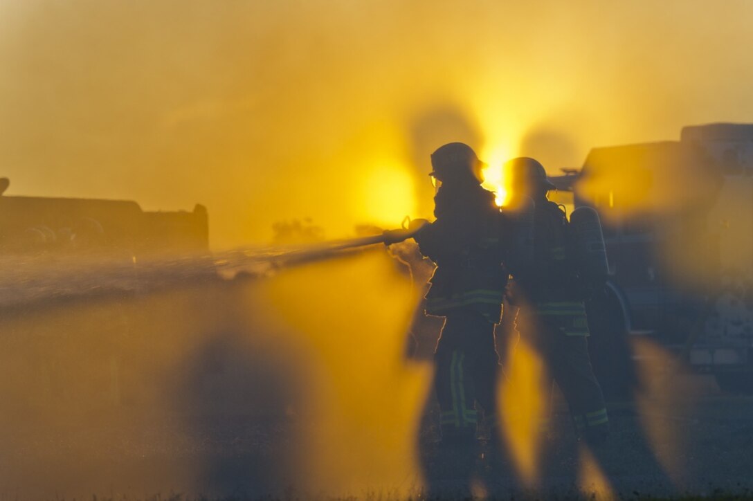 Air Force firefighters conduct fire-pit training during exercise Patriot Warrior at Sparta/Fort McCoy Airport, Wis.