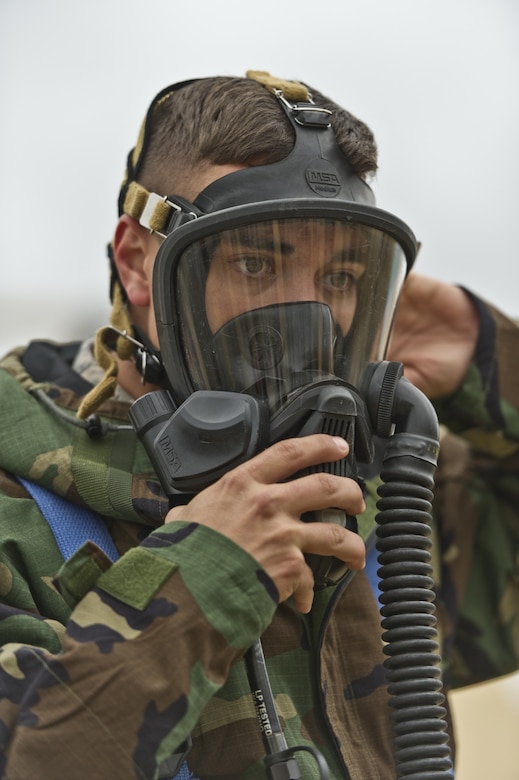 An Air Force firefighter participates in a chemical, biological, radiological, nuclear or explosive class during exercise Patriot Warrior at Young Air Assault Strip, Fort McCoy, Wis.