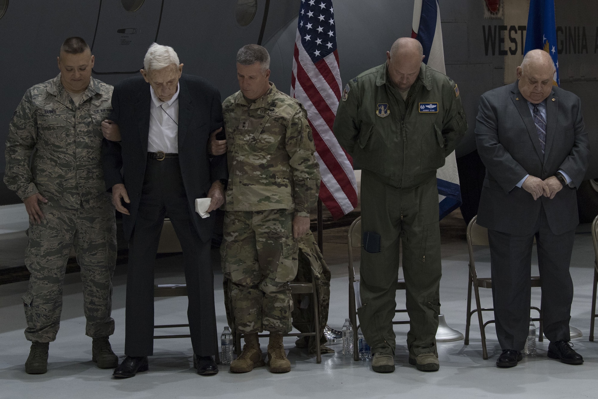 A local news reporter records a speech given by U.S. Army Maj. Gen. James Hoyer, the Adjutant General of the West Virginia National Guard, at a C-130H plane naming ceremony Dec. 7, 2017 at McLaughlin Air National Guard Base, Charleston, W.Va. The aircraft was given the name “The General Mac” to honor Brig. Gen. (ret) James K. McLaughlin, who founded the West Virginia Air National Guard and was a pilot in World War II with the famous Eight Air Force. (U.S. Air National Guard photo by Airman Caleb Vance)