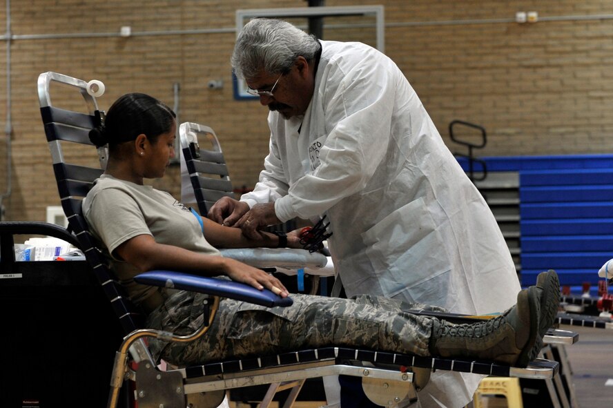 Master Sgt. Pricila Thomas, 56th Medical Group public health flight chief, prepares to donate her blood at Luke Air Force Base, Ariz., Dec. 7, 2017. The event was sponsored by the Armed Services Blood Program.  (U.S. Air Force photo/Senior Airman Pedro Mota)