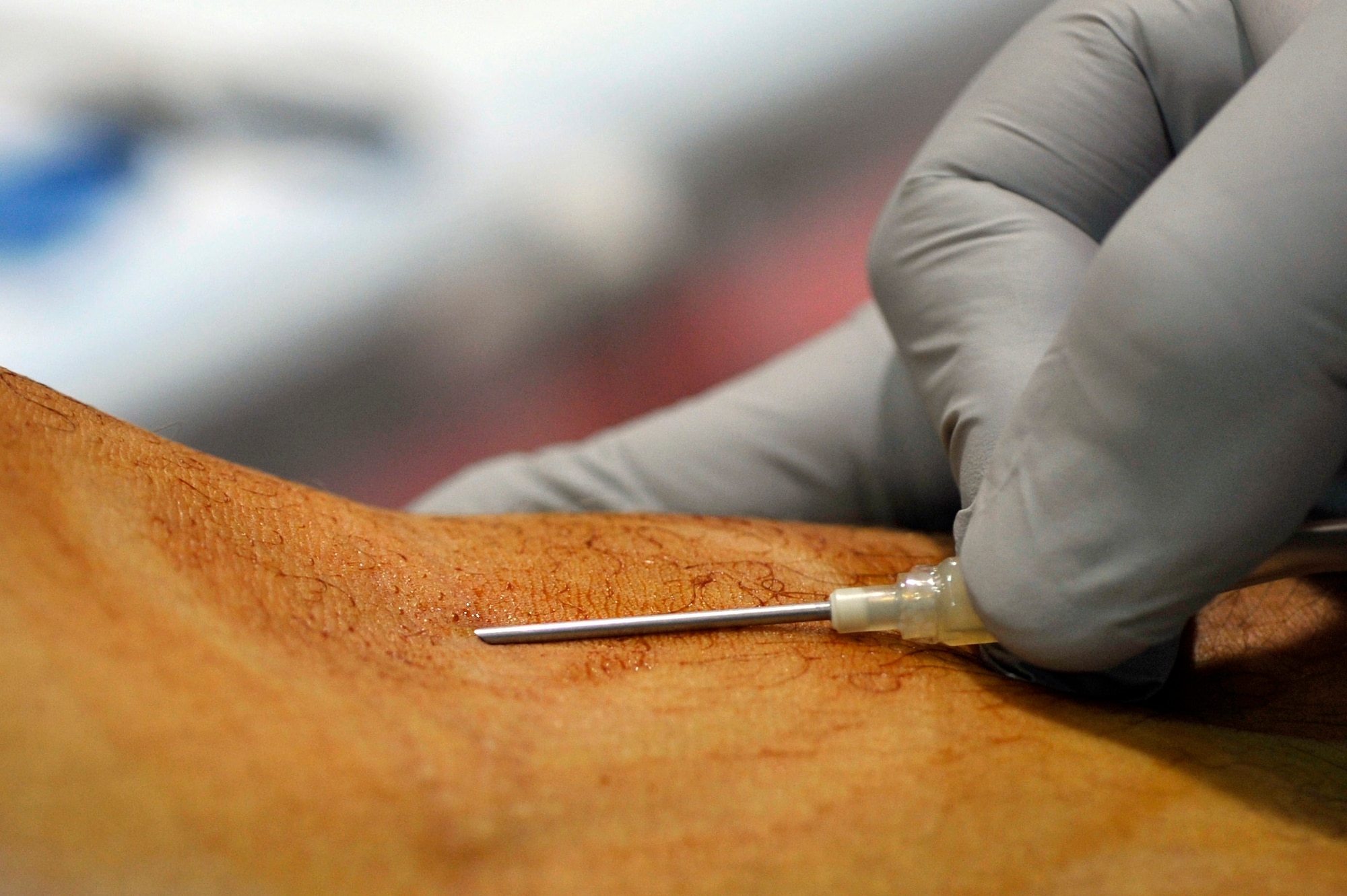 An Airman donates blood at Luke Air Force Base, Ariz., Dec. 7 2017. The blood donation took place during an Armed Services Blood Program event. (U.S. Air Force photo/Senior Airman Pedro Mota)