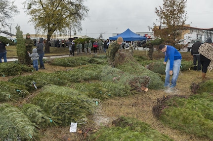 Members of the Joint Base San Antonio-Lackland community pick Christmas tress at JBSA-Lackland donated by the Christmas SPIRIT Foundation, FedEx and 18 tree farmers as part of the Trees for Troops program Dec. 7, 2017.