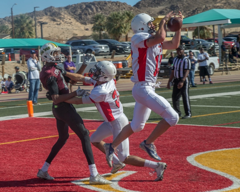 A player from 1st Tank Battalion’s team makes a catch in the endzone during the Best in the West Game at Felix Field aboard the Marine Corps Air Ground Combat Center, Twentynine Palms, Calif., Dec. 02, 2017. The Best in the West Game consisted of Camp Pendleton’s Headquarters and Service Battalion team and the Combat Center’s 1st Tank Battalion team. (U.S. Marine Corps photo by Lance Cpl. Preston L. Morris)