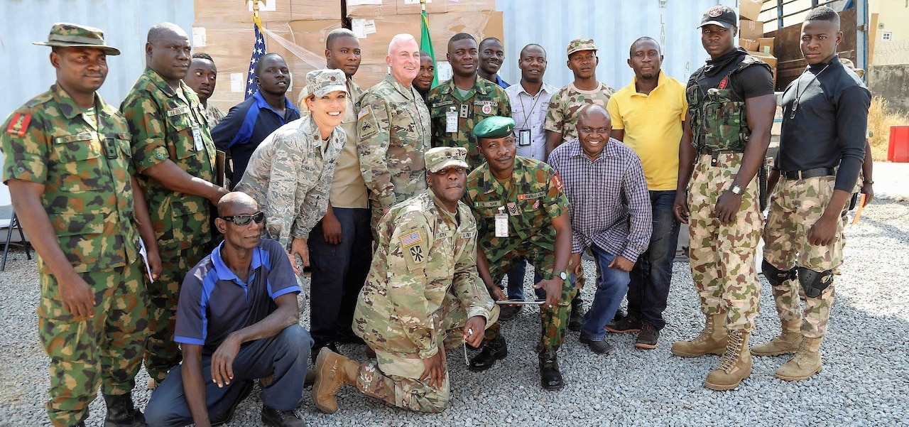 U.S. Army Africa acting commander Army Brig. Gen. Eugene J. LeBoeuf, center, poses for a group photo with U.S. service members and soldiers from the Nigerian Army in Abuja, Nigeria.