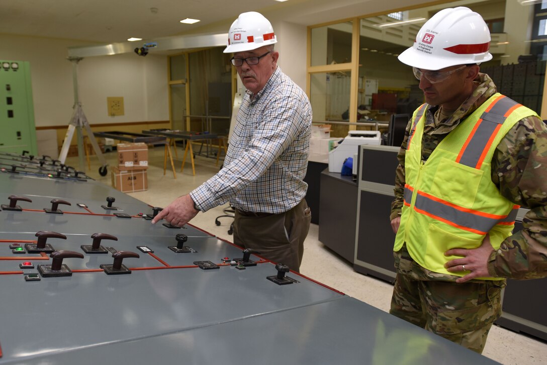 Col. Paul Kremer (Right), U.S. Army Corps of Engineers Great Lakes and Ohio River Division acting commander, gets briefed by Jeff Flowers, power plant project manager for the Nashville District’s Mid-Cumberland Area, during a tour of the Center Hill Dam power plant control room Dec. 5, 2017 in Lancaster, Tenn. (USACE photo by Lee Roberts)
