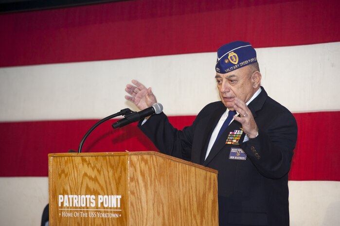 Retired U.S. Marine Corps Col. Robert Mastrion, a Silver Star recipient, addresses the audience on board the USS Yorktown at Patriots Point during the 76th Pearl Harbor Memorial Day Ceremony Dec. 7, 2017.