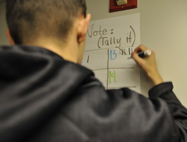A Joint Base Charleston dormitory resident casts his vote for the best homemade chili Dec. 6, 2017, at JB Charleston, S.C.