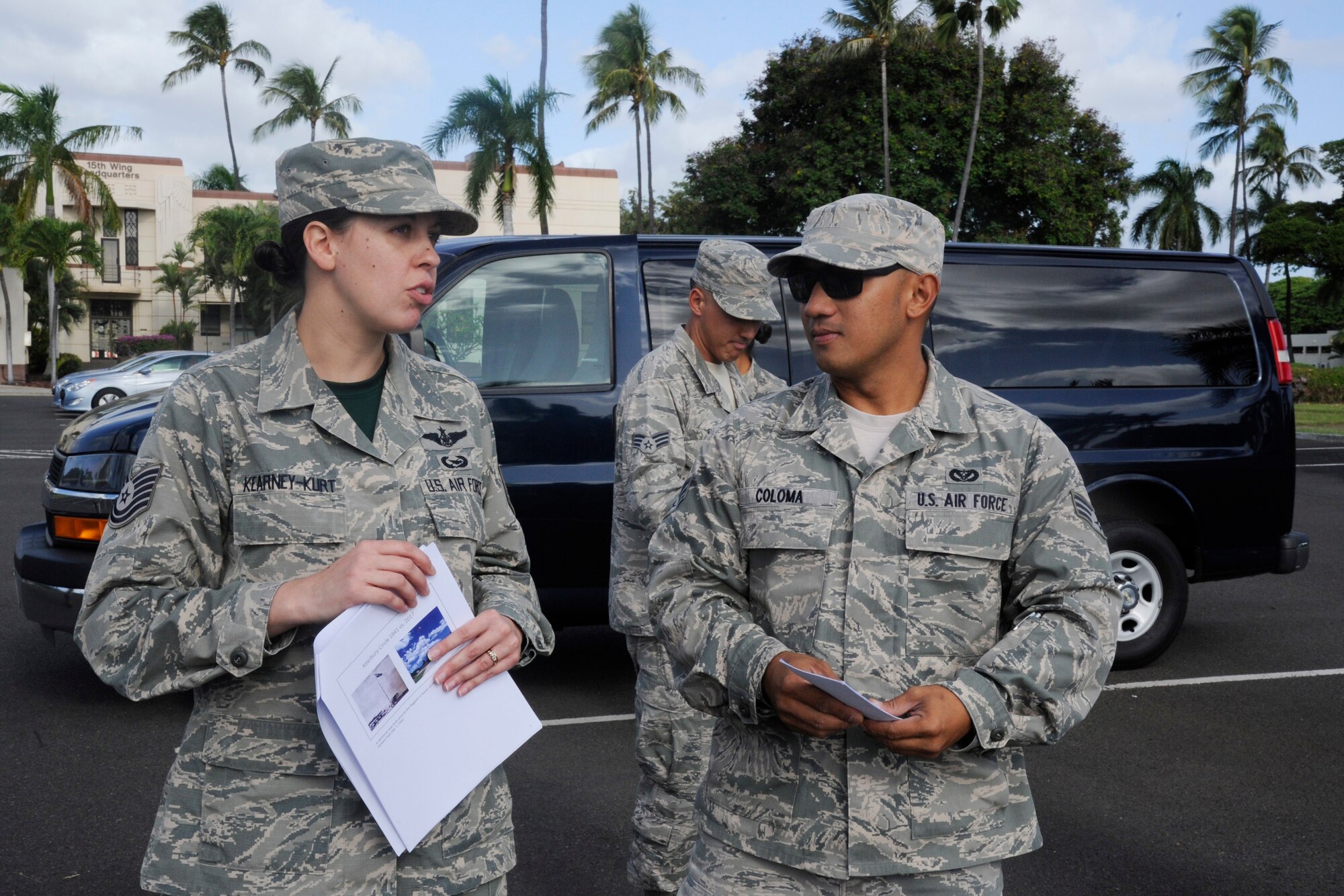 U.S. Air Force Tech. Sgt. Christine Kearney-Kurt, a historian for the Air Force Reserve 624th Regional Support Group, explains the size of the base in the 1940s compared to present day with Senior Airman Robert Coloma during a battlefield staff ride at Joint Base Pearl Harbor-Hickam, Hawaii, Dec. 3, 2017. The tour focused on the remnants of war from 76 years ago during the Dec. 7, 1941, attack at Hickam Field when America was launched into World War II. (U.S. Air Force photo by Master Sgt. Theanne Herrmann)