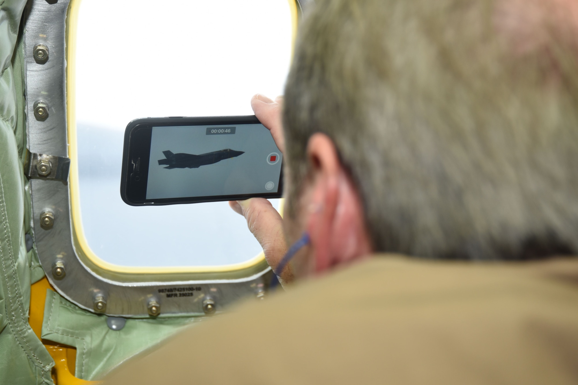 An F-35 out of Luke Air Force Base, Ariz., waits to refuel with the 434th Air Refueling Wing's KC-135 out of Grissom ARB, Ind., on November 17, 2017, giving Dallas/Fort Worth civic leaders an opportunity to get some sureal cell phone video. They also toured various naval assests throughout San Diego the day prior to gain a greater understanding of U.S. military strength. Taking time to visit the USS Fort Worth, USS Midway and the Fleet Readiness Center's F-18 were some tour highlights. (U.S. Air Force photo by Julie Briden-Garcia)