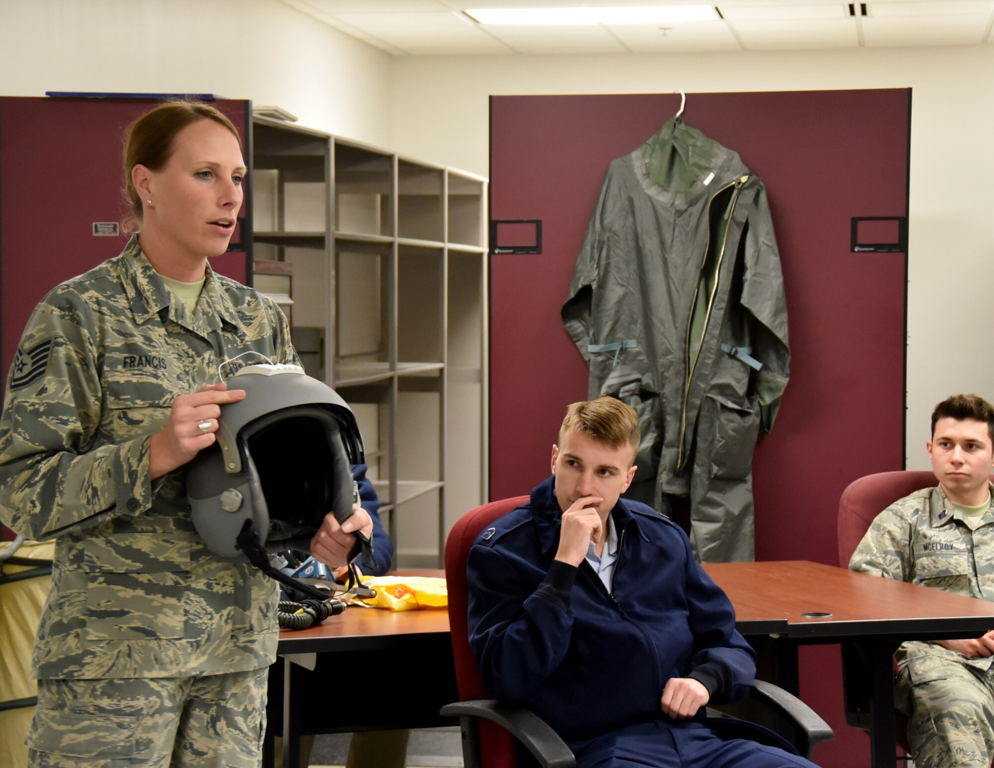 Tech. Sgt. Christine Francis, 931st Operations Support Squadron aircrew flight equipment technician, briefs cadets about Aircrew Flight Equipment  Dec. 8, 2017, McConnell Air Force Base, Kan.  The cadets were from the University of Kansas Air Force ROTC, Detachment 280, the Flying Jayhawks.  (U.S. Air Force photo by Tech. Sgt. Abigail Klein)