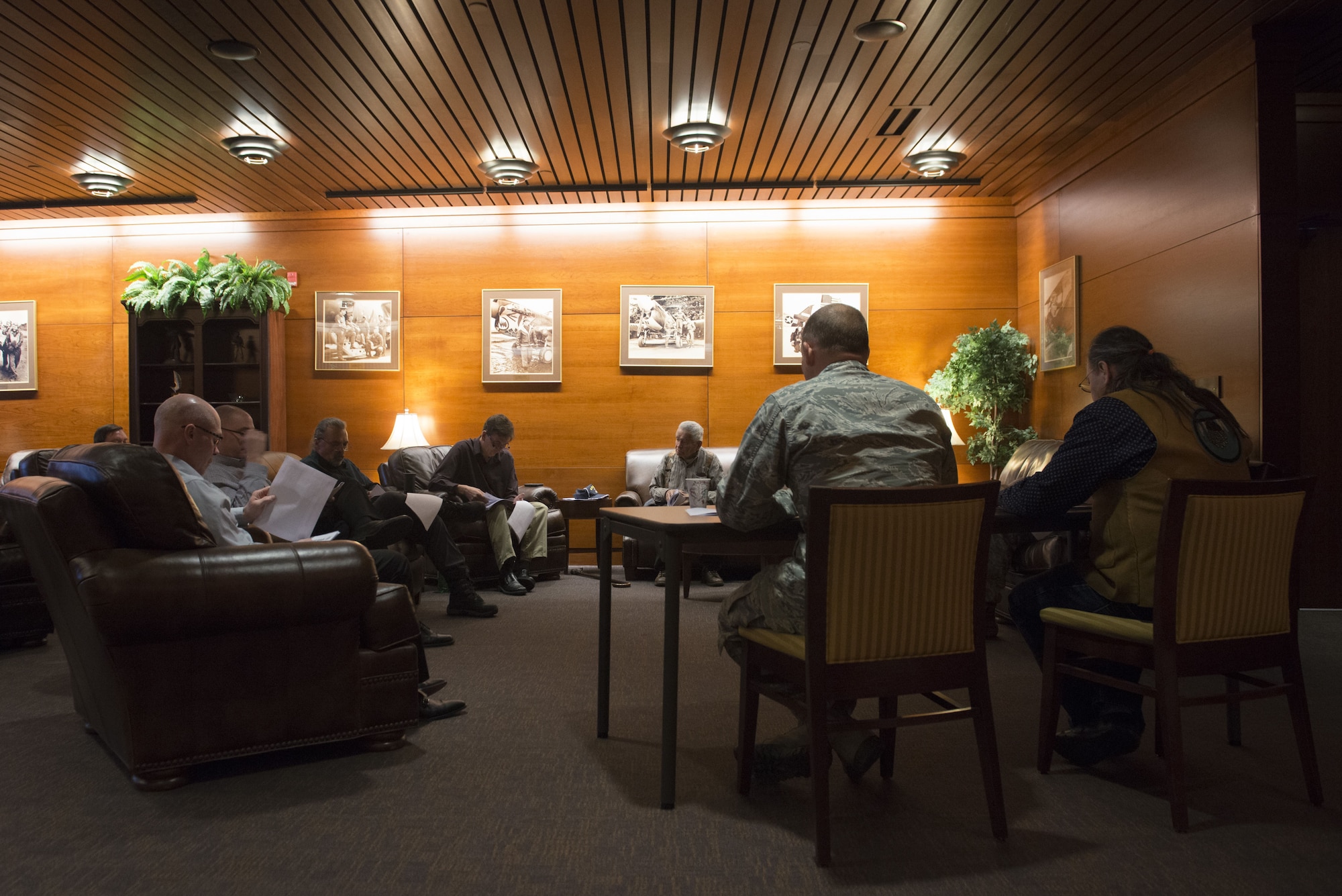Gary Harrison, Chickaloon Native Village chief, and Air Force Col. George Dietrich, 673d Air Base Wing and Joint Base Elmendorf-Richardson commander, discuss a memorandum of agreement at the Arctic Warrior Events Center at JBER, Alaska, Dec. 5, 2017. The MOA served to establish a relationship between JBER and the CNV to converse on mutual concerns, support and coordinate management of resources.