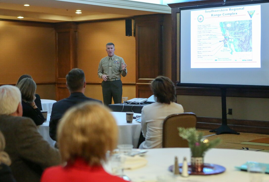 Col. Jason Woodworth, commanding officer of Marine Corps Air Station Miramar, Calif., speaks to San Diego city managers, Dec. 7, at the Doubletree Hotel in San Diego. Col. Woodworth spoke about the capabilities and importance of MCAS Miramar in the local San Diego community. (U.S. Marine Corps photo by Sgt. Brytani Wheeler)