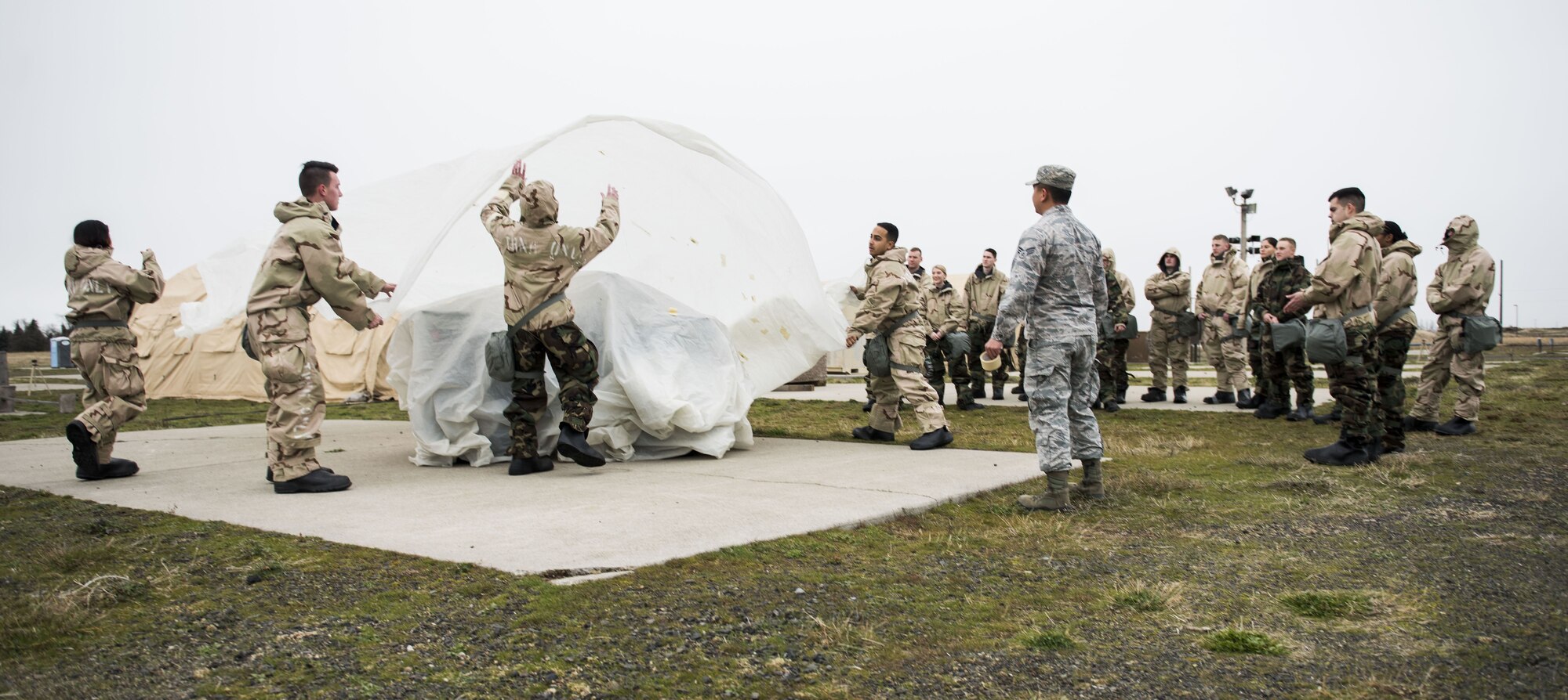 Team Fairchild Airmen train in how to prepare for a chemical attack, at Fairchild Air Force Base, Washington Nov. 30, 2017. Chemical Biological Radiological and Nuclear training is a vital readiness component for all Mobility Airmen. (U.S. Air Force photo/ Senior Airman Sean Campbell)