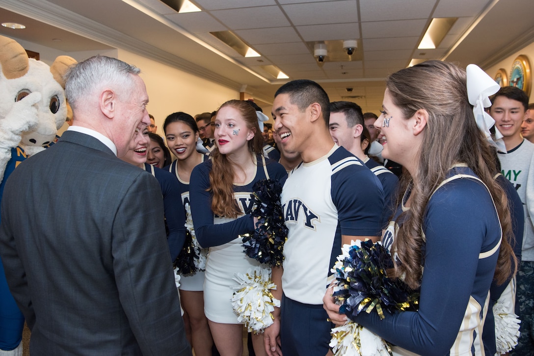 Defense Secretary James N. Mattis speaks with Navy cheerleaders at the Pentagon.