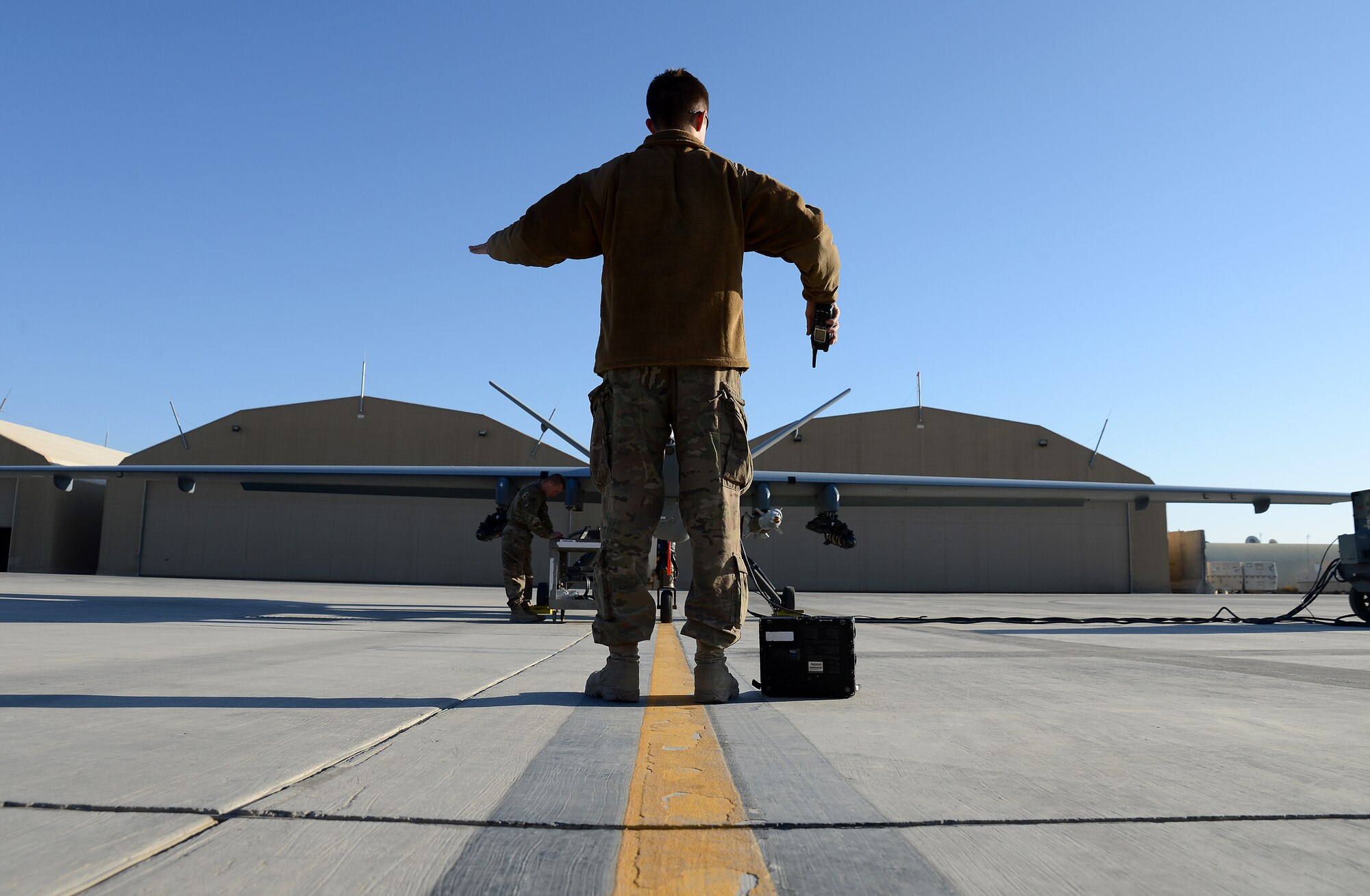 Airman 1st Class Gavin Claus, 62nd Expeditionary Attack Squadron crew chief, prepares an MQ-9 Reaper for takeoff Nov. 27, 2017 at Kandahar Airfield, Afghanistan.