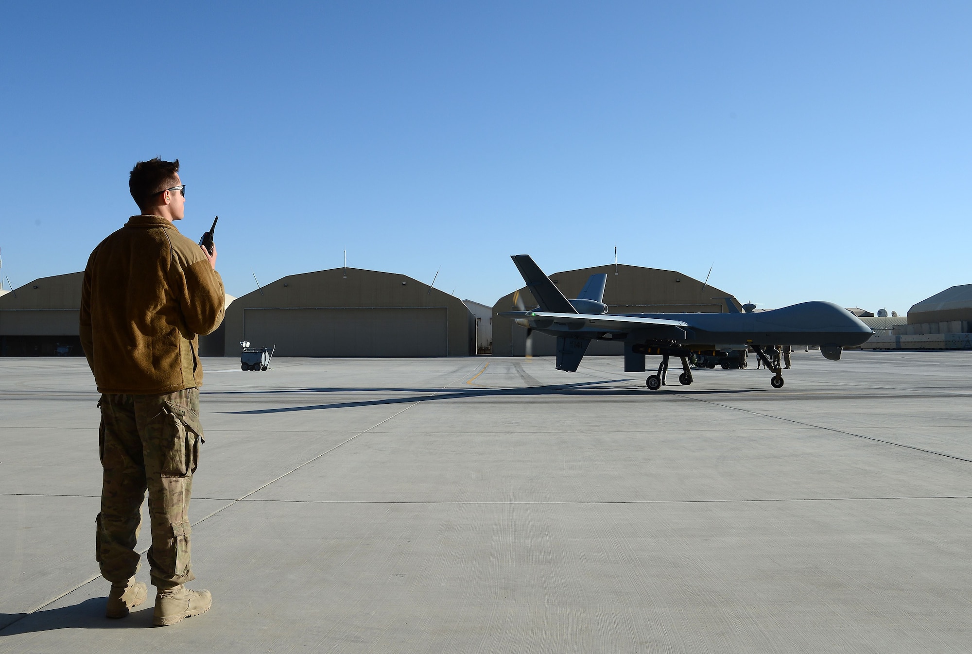 Airman 1st Class Gavin Claus, 62nd Expeditionary Attack Squadron crew chief, prepares a MQ-9 Reaper for takeoff Nov. 27, 2017 at Kandahar Airfield, Afghanistan.