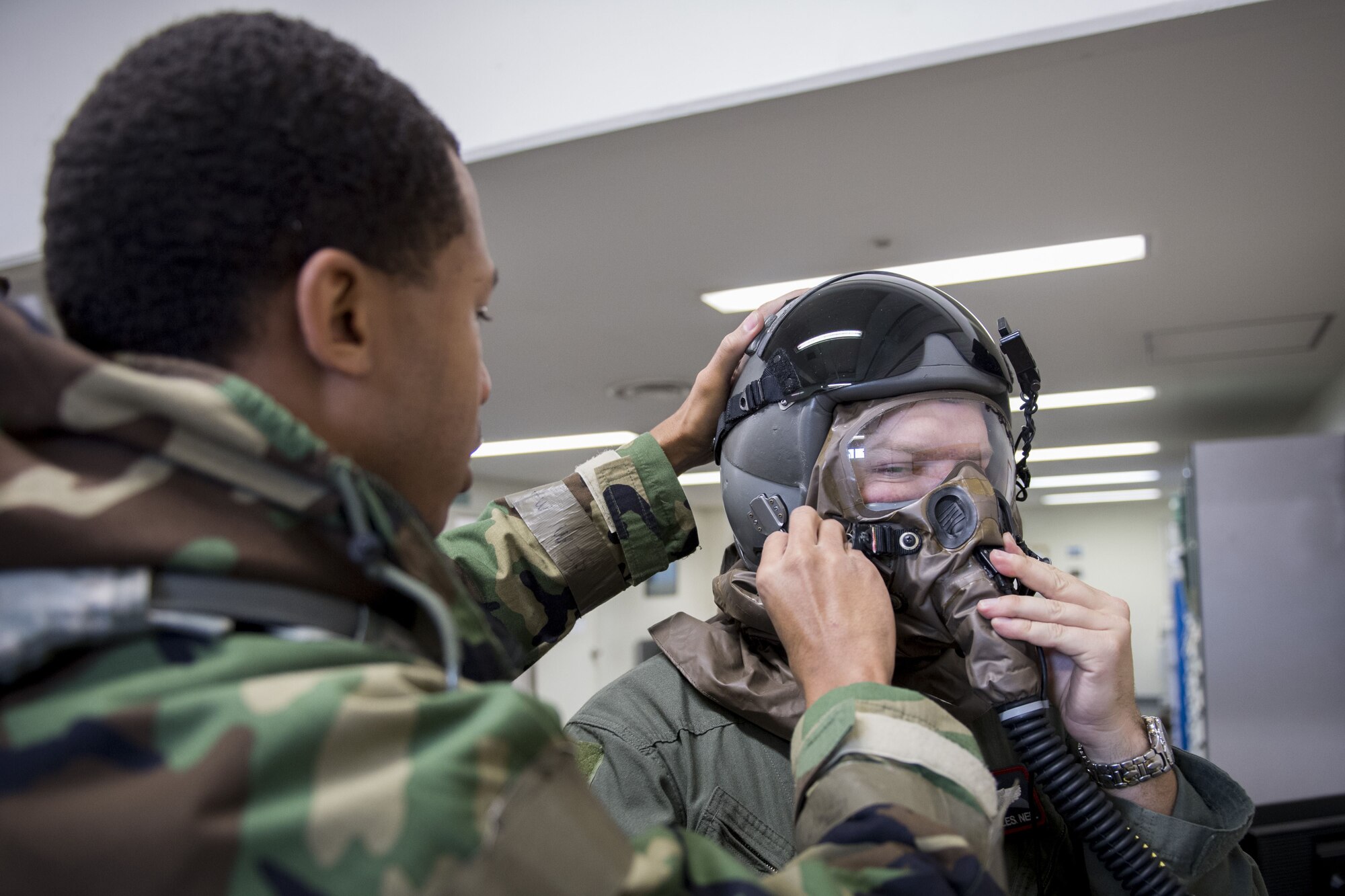 Staff Sgt. Terrance Macklin, 374th Operations Support Squadron aircrew flight equipment craftsman, performs an inspection on aircrew chemical, biological, radiological and nuclear protective gear during exercise Vigilant Ace 18, Dec. 6, 2017, at Yokota Air Base, Japan.
