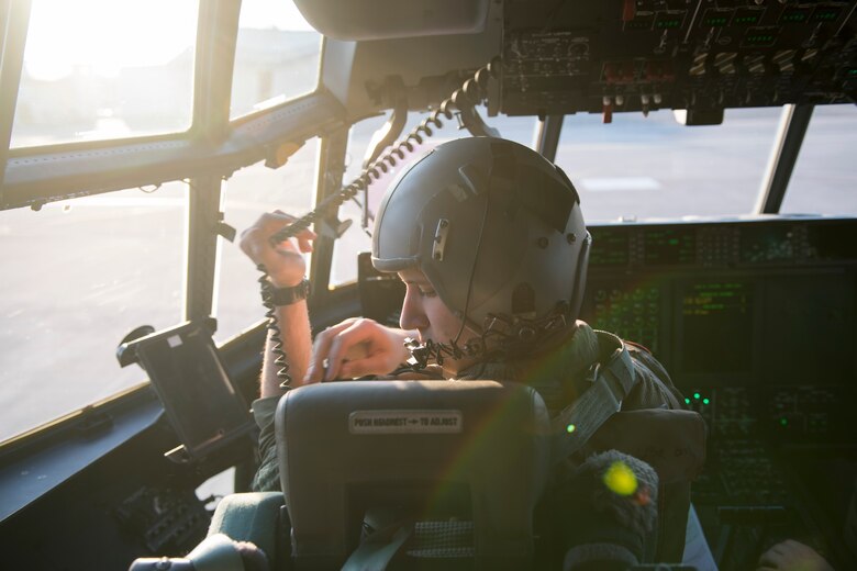 Capt. Jordan Hechinger, 41st Troop Carrier Squadron C-130J Super Hercules pilot, straps himself into the pilot’s seat during exercise Vigilant Ace 18, Dec. 6, 2017, at Yokota Air Base, Japan.