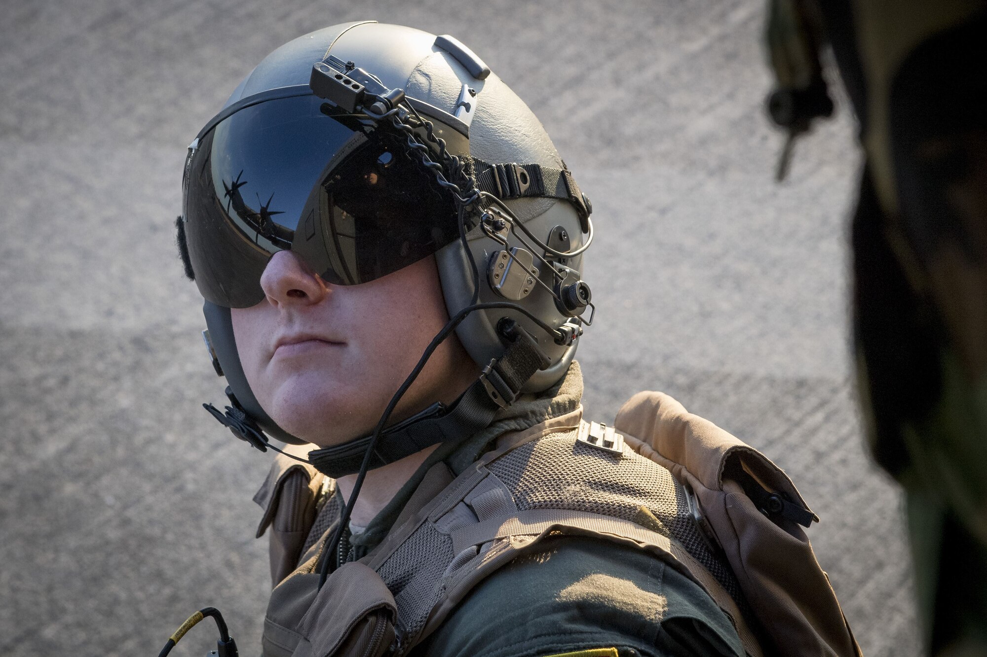 Airman 1st Class Matt Madson, 41st Troop Carrier Squadron C-130J Super Hercules loadmaster, looks into a C-130J during exercise Vigilant Ace 18, Dec. 6, 2017, at Yokota Air Base, Japan.