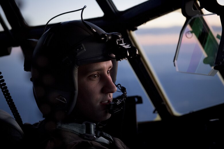 Capt. Jordan Hechinger, 41st Troop Carrier Squadron C-130J Super Hercules pilot, communicates with the co-pilot during exercise Vigilant Ace 18, Dec. 6, 2017, over the Saitama prefecture, Japan.