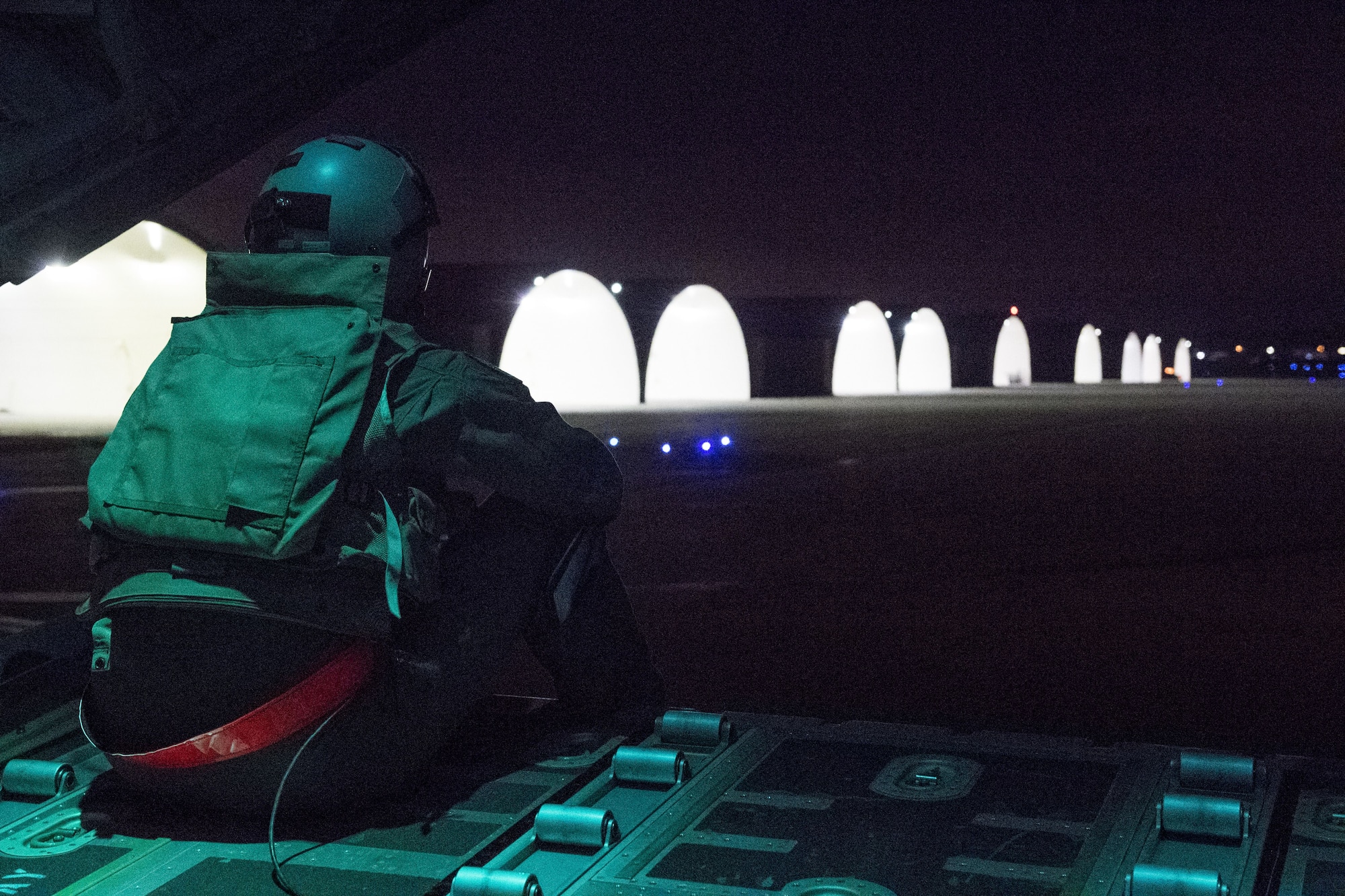Airman 1st Class Matt Madson, 41st Troop Carrier Squadron C-130J Super Hercules loadmaster, looks out the tailgate while taxiing during exercise Vigilant Ace 18, Dec. 6, 2017, at Osan Air Base, Republic of Korea.