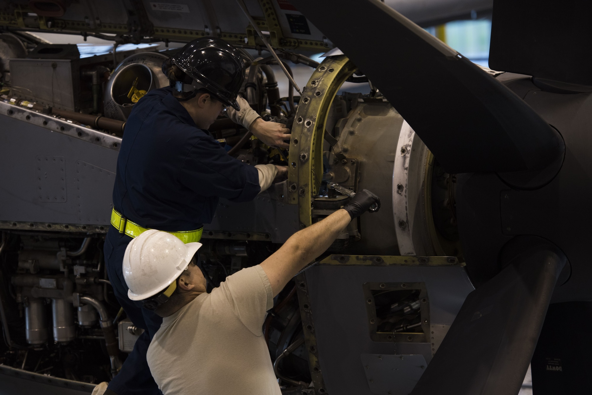 U.S. Air Force Staff Sgt. Lindsay Hallford (left), 86th Maintenance Squadron C-130J Super Hercules crew chief, and Staff Sgt. David Gilliland, 86th MXS aerospace propulsion craftsman, finish repairs on a C-130J engine during a C1-check on Ramstein Air Base, Germany, Dec. 5, 2017. Airmen from every career field in the maintenance squadron help get the aircraft airborne. (U.S. Air Force photo by Senior Airman Devin M. Rumbaugh)