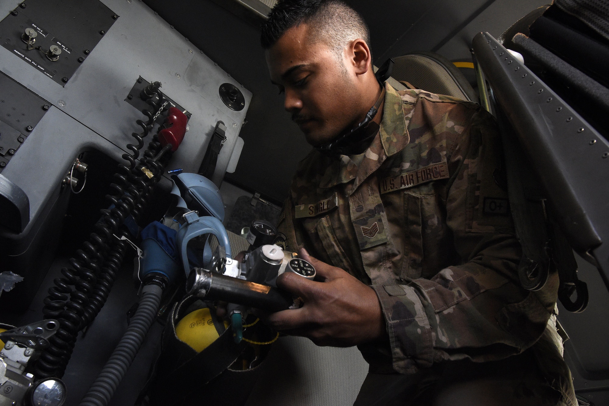 Staff Sgt. Anthony Single, 455th Expeditionary Aircraft Maintenance Squadron C-130J Super Hercules crew chief, inspects an oxygen mask Dec. 5, 2017 at Bagram Airfield, Afghanistan.
