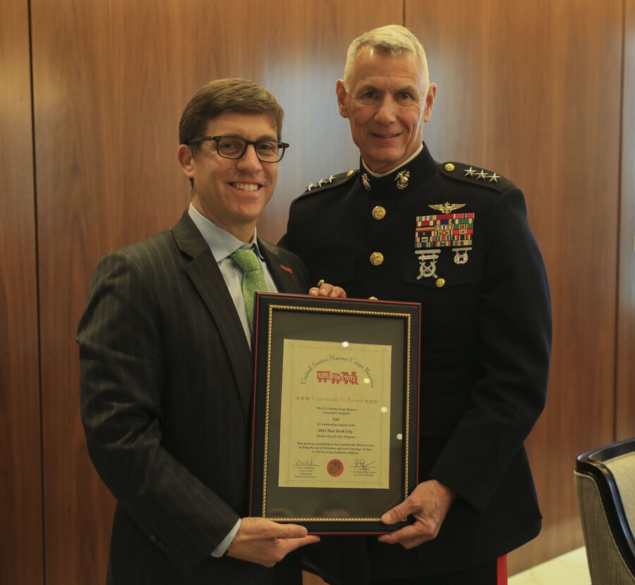 Christopher Perkins (left), the managing director of Citigroup, Lt. Gen. Rex McMillian (center), commander of Marine Forces Reserve and Marine Forces North, and Michael O’Neil (right), the chairman of Citigroup pose for a group photo on Dec. 8, 2017 at Citigroup Center, New York. McMillian spoke with Citigroup employed veterans and executives about the Marine Forces Reserve Toys for Tots program. This is the 70th anniversary season of Toys for Tots. Since its inception in 1947, the nationwide Marine Corps Reserve sponsored program, has collected and distributed more than 570 million toys.