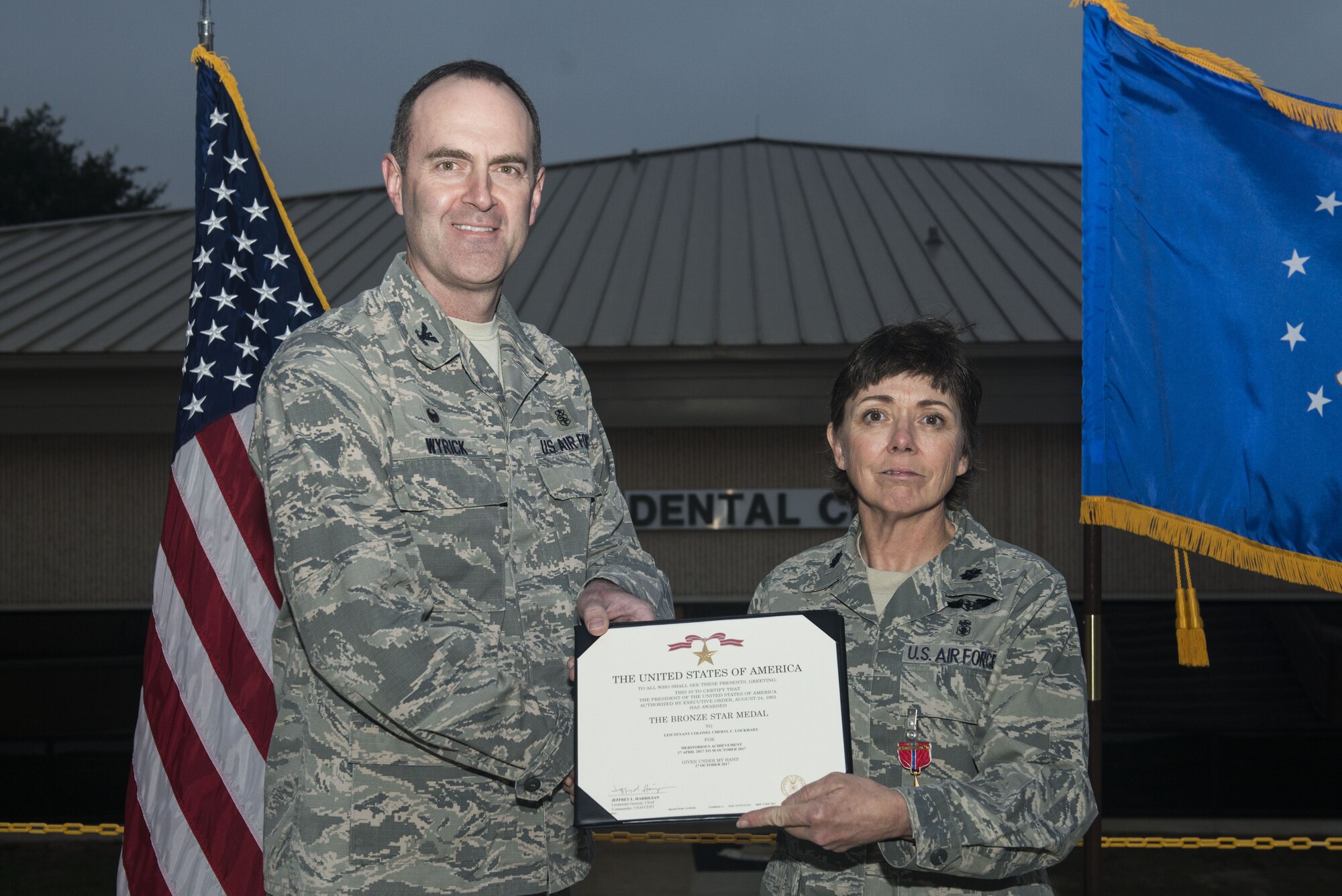 U.S. Air Force Lt. Col. Cheryl Lockhart, 20th Medical Group (MDG) chief nurse, receives a Bronze Star Medal certificate from Col. Brian Wyrick, 20th MDG commander, at Shaw Air Force Base, South Carolina, Nov. 8, 2017.
