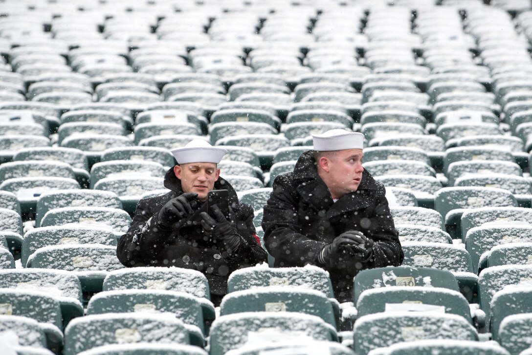 Sailors get an early, snowy seat before the start of the Army-Navy game.