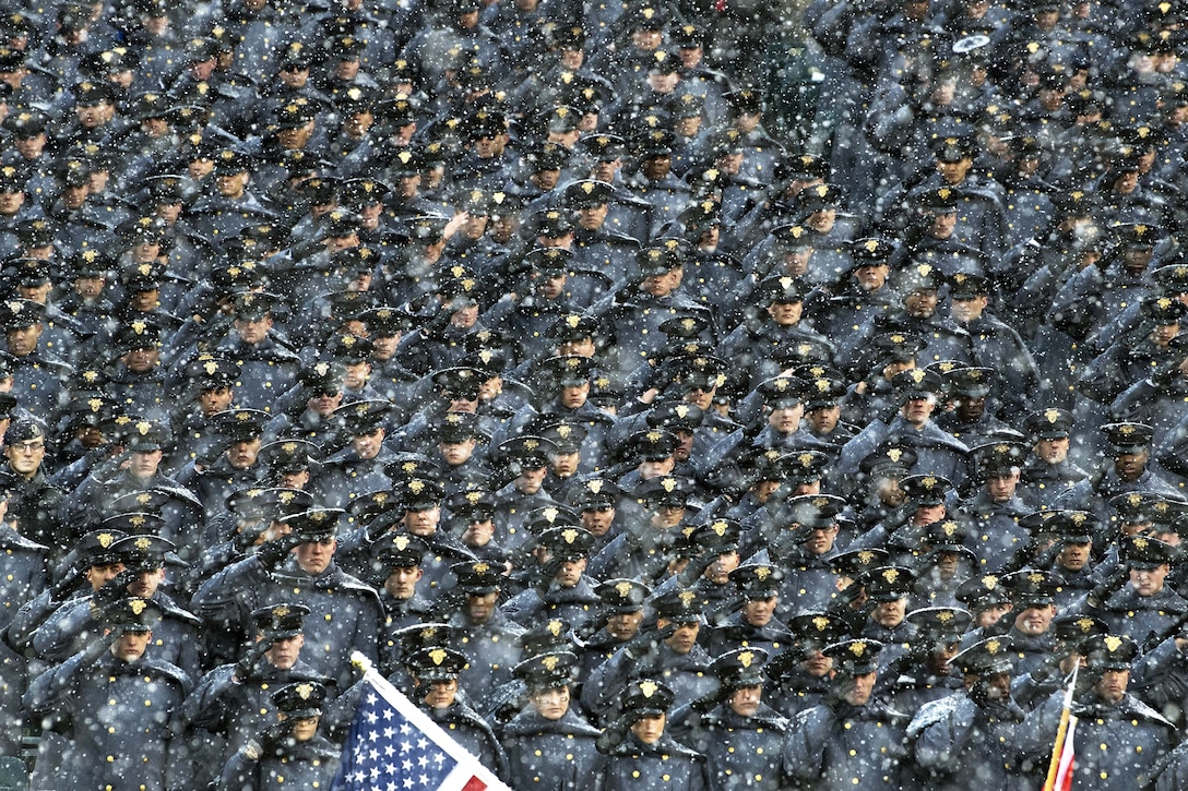 United States Military Academy cadets salute during the Army-Navy game.
