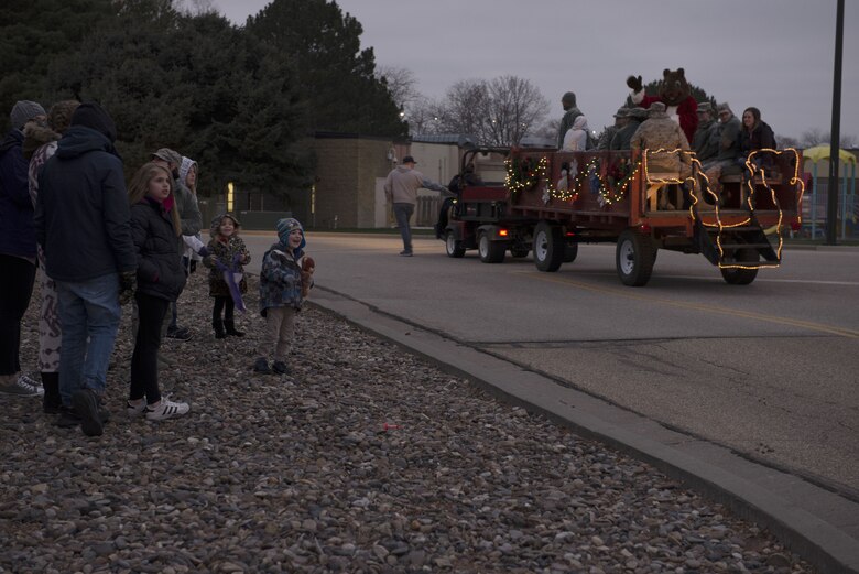 A child smiles as he see's Santa approaching during the holiday parade Dec. 8, 2017, at Mountain Home Air Force Base, Idaho. The parade float participants tossed candy and toys at children who watched the parade. (U.S. Air Force photo by Senior Airman Lauren-Taylor Levin)