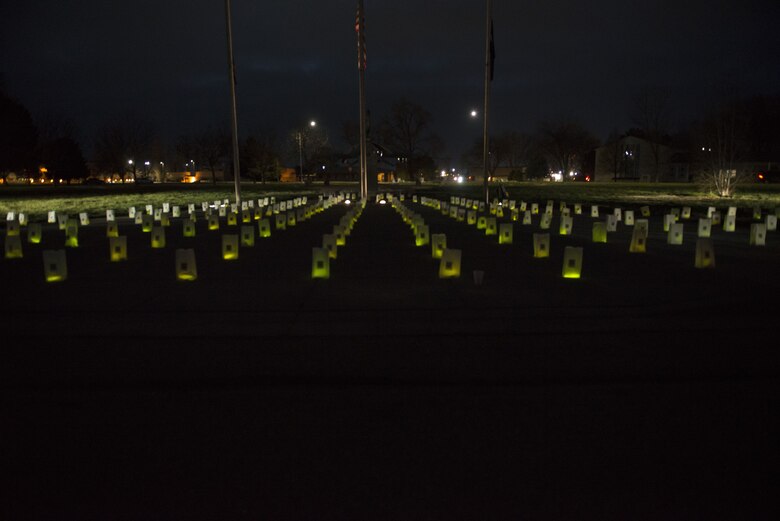 Lit bags glow after Gunfighter Glow on Dec. 8, 2017 at Mountain Home Air Force Base, Idaho. The bags will stay in place during the holiday season to remember all Gunfighters who are currently deployed and away from their loved ones. (U.S. Air Force photo by Senior Airman Lauren-Taylor Levin)