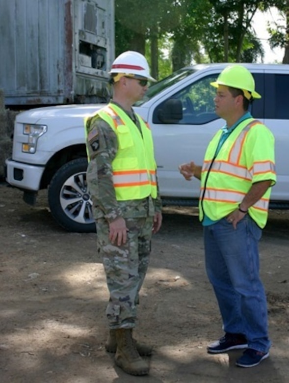 Col. Andrew Yoder, Recovery Field Office commander, meets with Guaynabo Mayor Angel Perez Otero, during an engagement at the Los Alamos Reduction Site in Guaynabo on Dec. 9, 2017. The day was significant in that the U.S. Army Corps of Engineers, with the help of locally-hired contractors, collected its 1 millionth cubic yard of debris on the island of Puerto Rico in the aftermath of hurricanes Irma and Maria. The milestone is significant in that it comes one day after the largest collection day since operations began, with 38, 239 cubic yards of debris collected Dec. 8.