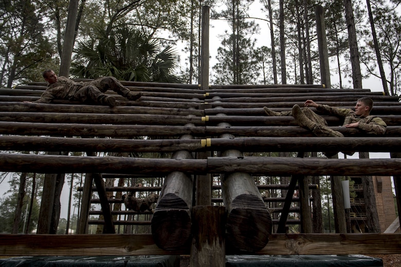 Airmen from the 820th Base Defense Group navigate the weaver obstacle during an Army Air Assault readiness assessment, Dec. 7, 2017, at Camp Blanding, Fla. The AAA readiness assessment is designed to prepare Airmen for the Army Air Assault School curriculum as well as its physical and mental stressors. During AAA, U.S. troops are taught an array of skills associated with rotary-winged aircraft. These skills widen the 820th BDG’s ability to swiftly deploy and defend. (U.S. Air Force photo by Senior Airman Daniel Snider)