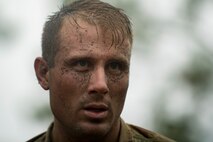 Airman 1st Class Brian Piperato, 824th Base Defense Squadron fireteam member, recovers after completing an obstacle during an Army Air Assault readiness assessment, Dec. 7, 2017, at Camp Blanding, Fla. The AAA readiness assessment is designed to prepare Airmen for the Army Air Assault School curriculum as well as its physical and mental stressors. During AAA, U.S. troops are taught an array of skills associated with rotary-winged aircraft. These skills widen the 820th Base Defense Group’s ability to swiftly deploy and defend. (U.S. Air Force photo by Senior Airman Daniel Snider)