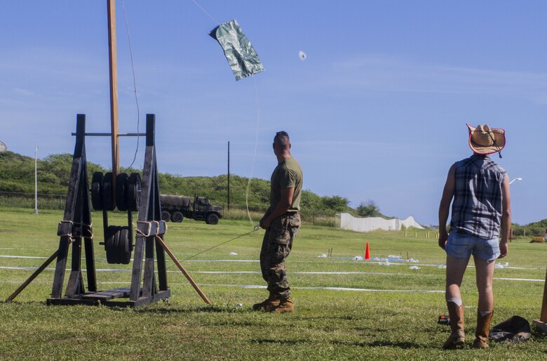 U.S. Marines with 1st Battalion, 12th Marine Regiment (1/12) fire their trebuchet during their annual celebration of St. Barbara’s day, Dec. 7, 2017. The unit honored St. Barbara, the patron saint of artillery, by pitting teams from each battery against each other and challenging them to build and operate their own trebuchet, a medieval siege weapon. The event served to promote healthy competition and cohesion between Marines of 1/12, while also teaching the history of their occupation.   (U.S. Marine Corps photo by Lance Cpl. Luke Kuennen)