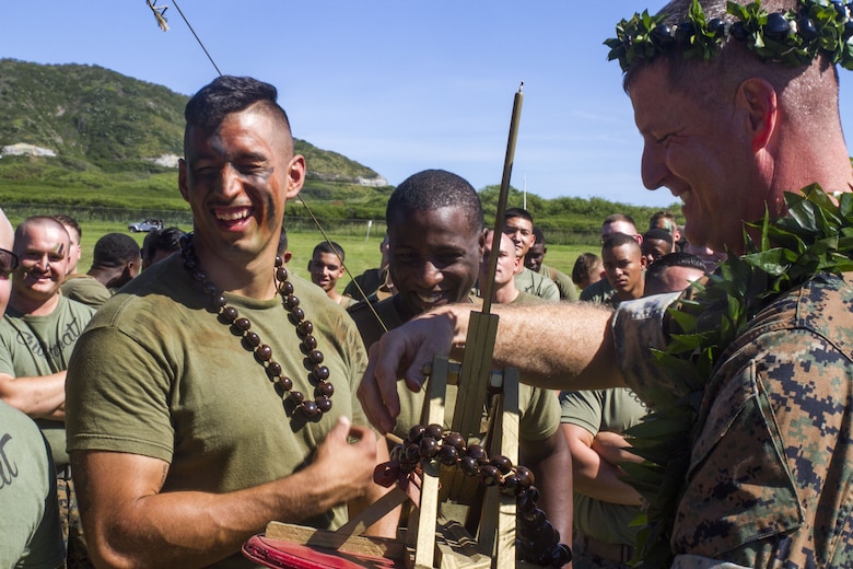 U.S. Marines with Charlie battery, 1st Battalion, 12th Marine Regiment (1/12), receive their awards for winning the annual celebration of St. Barbara’s day, Dec. 7, 2017. The unit honored St. Barbara, the patron saint of artillery, by pitting teams from each battery against each other and challenging them to build and operate their own trebuchet, a medieval siege weapon. The event served to promote healthy competition and cohesion between Marines of 1/12, while also teaching the history of their occupation.   (U.S. Marine Corps photo by Lance Cpl. Luke Kuennen)