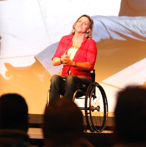 Carlana Stone, guest speaker for the Ready and Resilient campaign, addresses Soldiers and Department of Defense civilians Dec. 8 about the adversity she has faced and the resilient path she took to help herself and others at the main theater at Joint Base San Antonio-Fort Sam Houston. Stone, a paraplegic author and motivational speaker, said she enjoys speaking to service members because they are the embodiment of the resilient spirit.