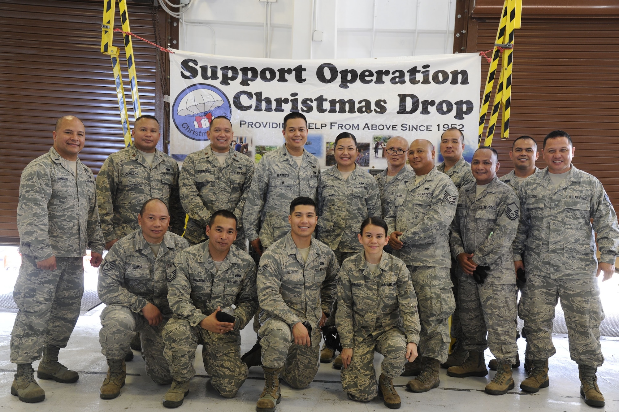 Reserve Citizen Airmen from the 44th Aerial Port Squadron during Operation Christmas Drop Dec. 9, 2017, at Andersen Air Force Base, Guam. Operation Christmas Drop has been providing critical supplies to 56 Micronesian Islands since 1952. The 44th Aerial Port Squadron supports the 624th Regional Support Group’s mission of providing mission essential combat readiness, quality management and peacetime deployments in the Pacific area of responsibility. (U.S. Air Force photo by Staff Sgt. Daena Mansapit)
