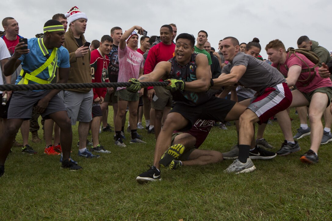 MCAS FUTENMA, OKINAWA, Japan- Marines compete in the Christmas tree workout during the Annual Jingle Bell Challenge Dec. 1 on Marine Corps Air Station Futenma, Okinawa, Japan.