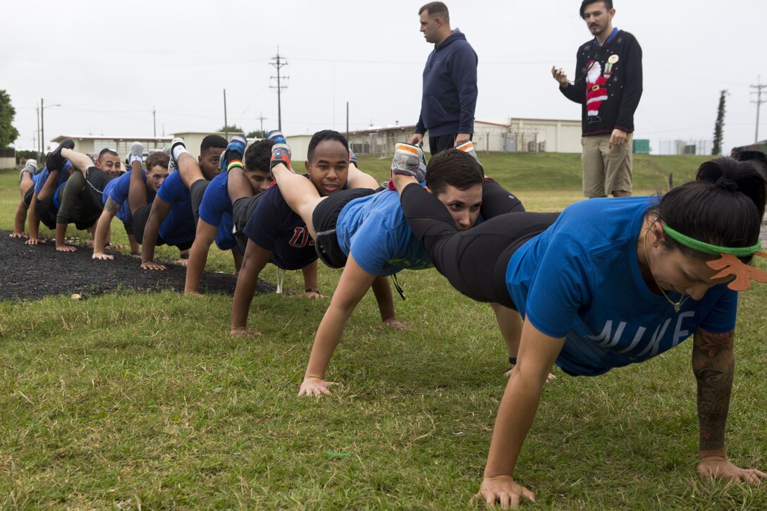 MCAS FUTENMA, OKINAWA, Japan- Marines compete in the elf tryouts during the Annual Jingle Bell Challenge Dec. 1 on Marine Corps Air Station Futenma, Okinawa, Japan.
