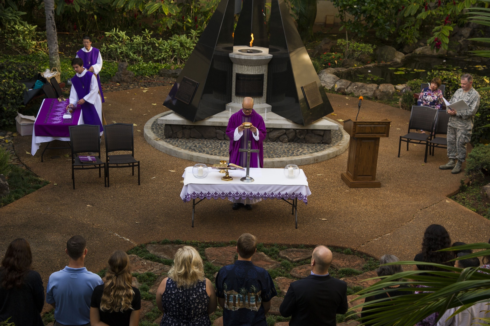 U.S. Navy Capt. John Shimotsu, U.S. Pacific Command chaplain, holds a Catholic Mass at the Courtyard of Heroes during a remembrance ceremony for U.S. Army Air Corps Pfc. Joseph Nelles, Joint Base Pearl Harbor-Hickam, Hawaii, Dec. 10, 2017.  Nelles, a chaplain’s assistant, was killed during the 1941 attack on Hickam Field.  (U.S. Air Force photo by Tech. Sgt. Heather Redman)