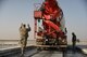 Master Sgt. Terry Babler, a project manager assigned to the 332nd Expeditionary Civil Engineer Squadron, guides the driver of a cement truck as he backs into a slab prior to pouring concrete on a runway in an undisclosed location in Southwest Asia Nov. 28, 2017. Babler worked with more than 20 other members of his squadron to repair six slabs of a damaged runway to ensure aircraft were ready to provide agile combat support when called upon. (U.S. Air Force photo by Senior Master Sgt. Cohen A. Young)